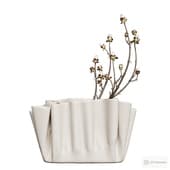 a chestnut branch in a modern vase.