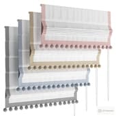 roman curtain with pom-poms in the nursery