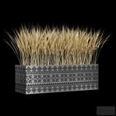 a bouquet of barley ears in a slavic-style planter.
