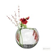 bouquet of twigs and lilies in a vase