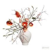 a bouquet of carnations and branches of quince and magnolia in a vase.
