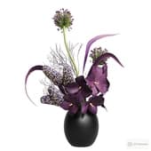 bouquet of wanda orchids, alliums and mini corn cobs in a vase.