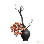 a branch and physalis in a vase